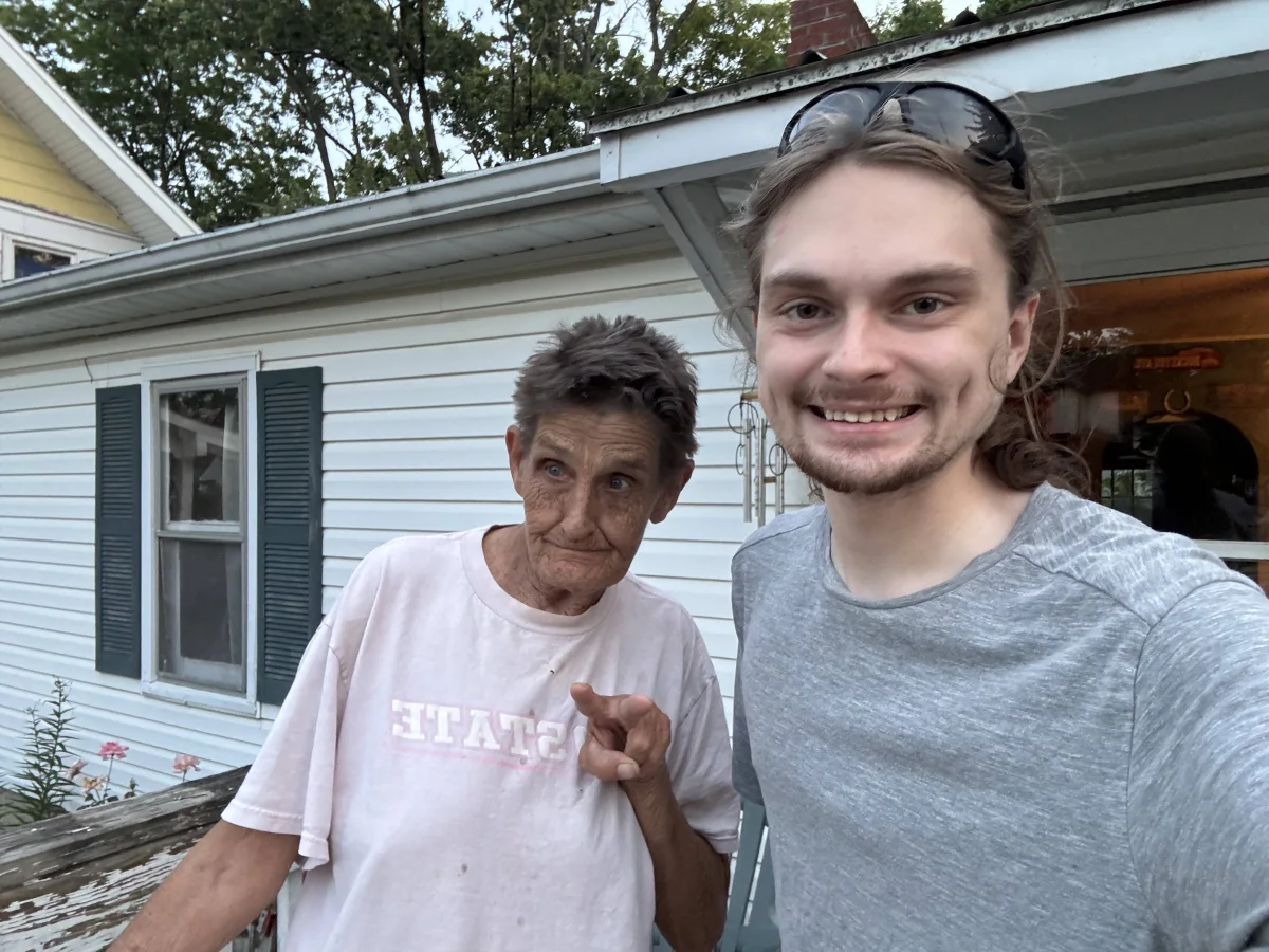 Levi with a family friend after working through security and spam settings on her Android phone